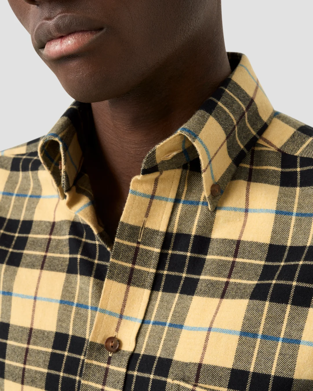 princess polly baby blue dress Young Black Man in Black Shirt and Yellow Tie Stock Image