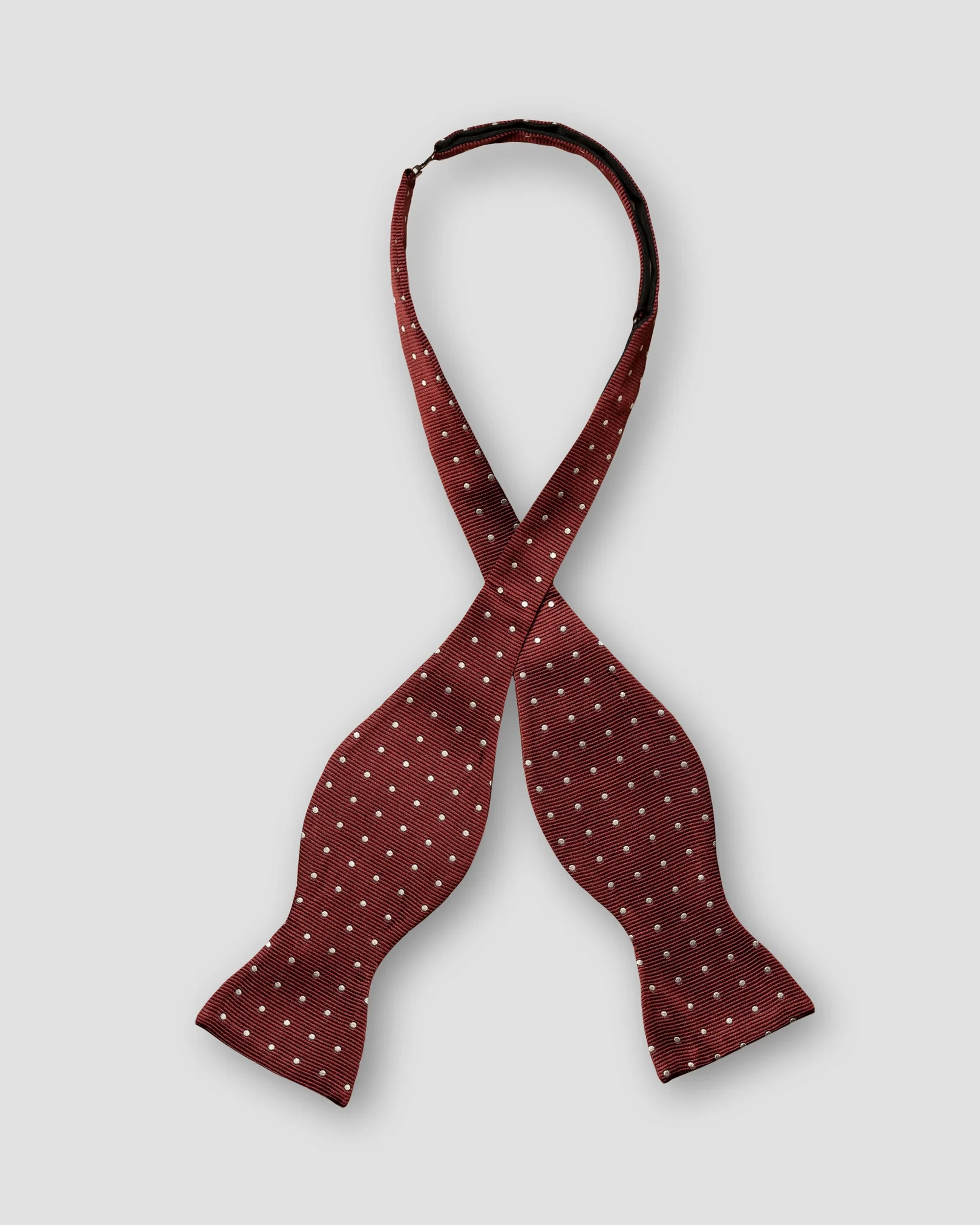 Eton - dark red bow tie self tied