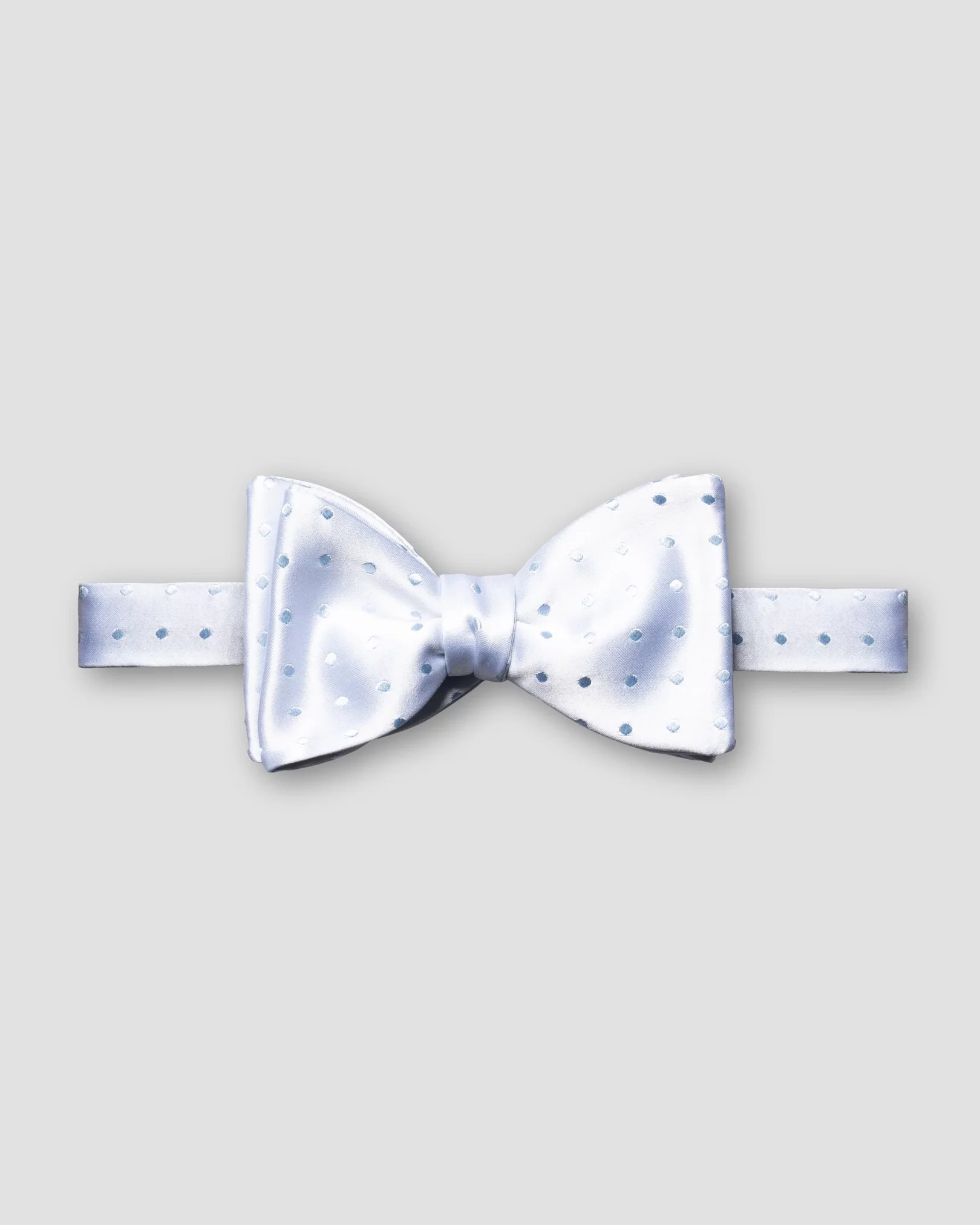 Eton - blue dotted bow tie self tied