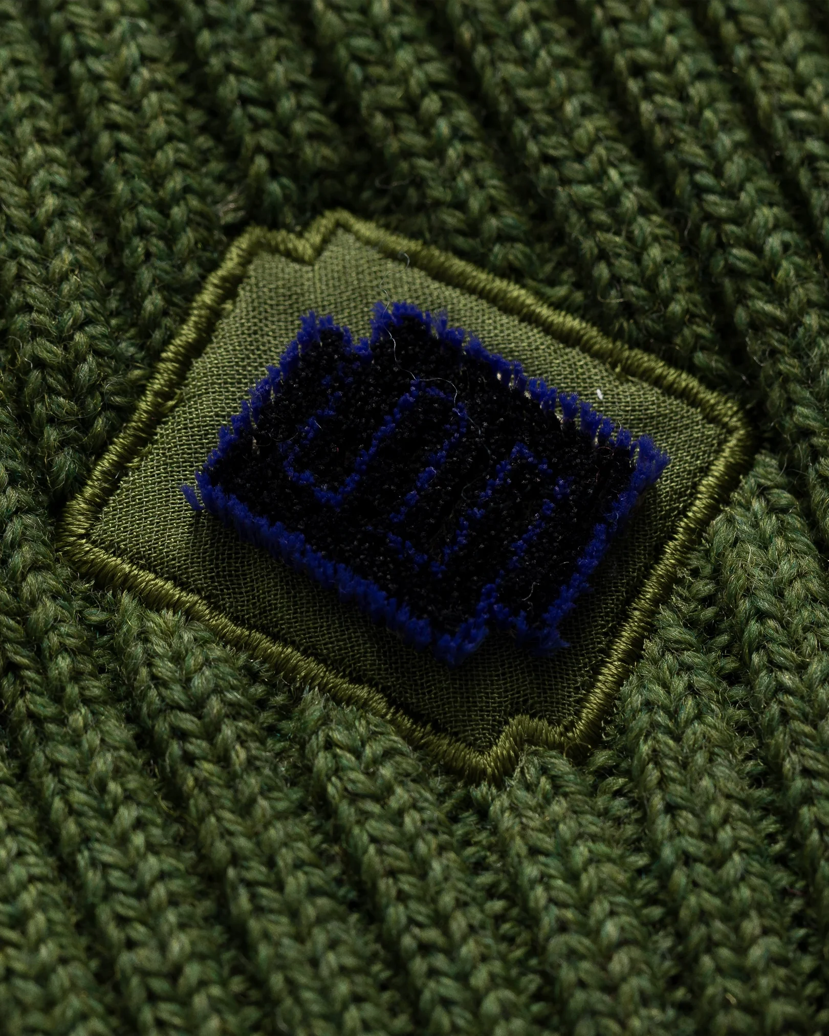 Eton - green wool beanie logo detail