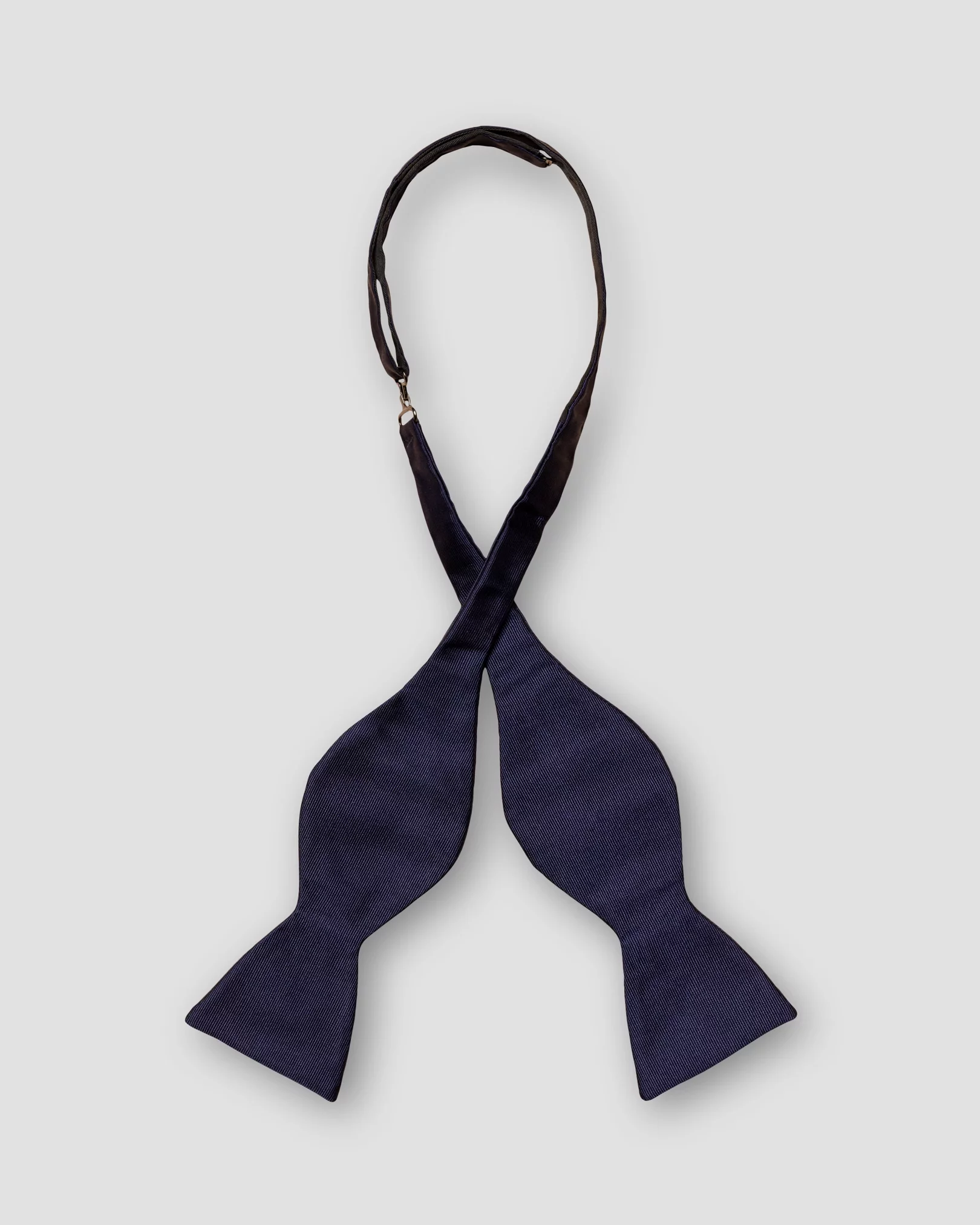 Eton - dark blue bow tie self tied dressed